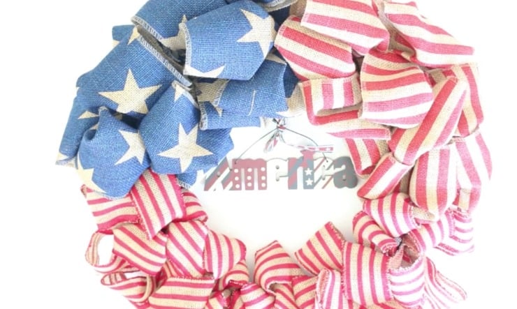 Layered patriotic ribbon wreath with striped and star-patterned burlap ribbon details