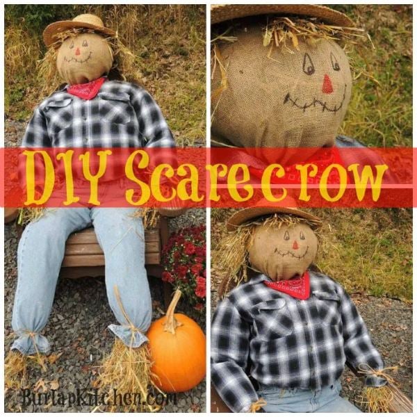 Seated DIY scarecrow surrounded by pumpkins, hay bales, mums, and corn stalks on a fall porch.